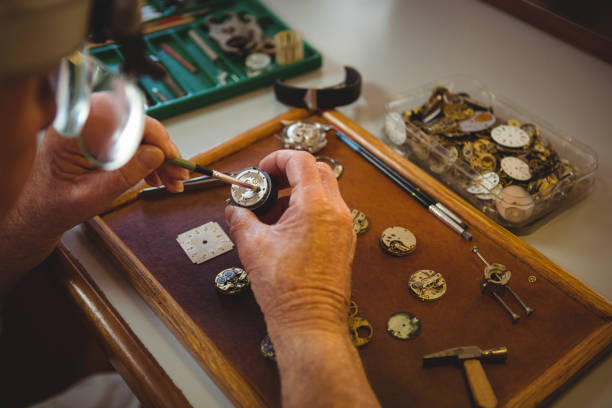istock Horologist repairing a watch 649082300