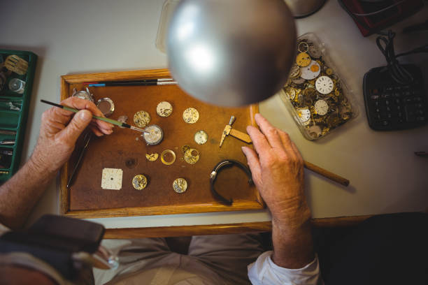 istock Horologist repairing a watch 649084320