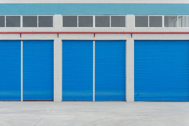 istock blue metal shutter doors on commercial shop front 649084520