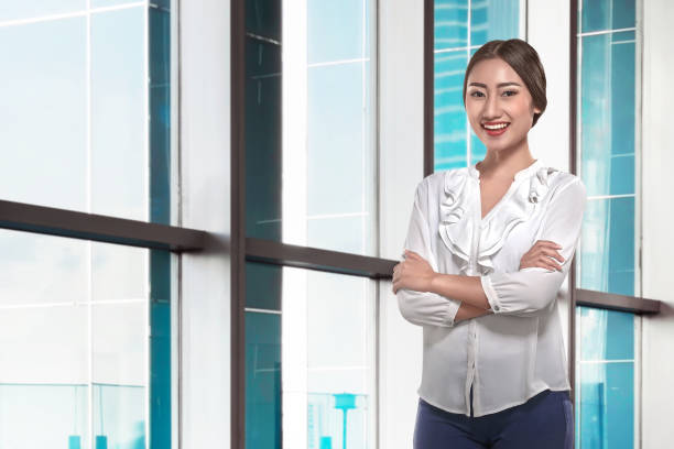 istock Modern asian business woman with folded arms 649087394