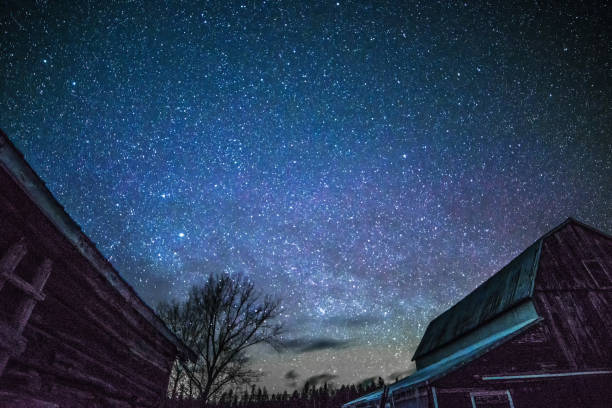 istock Rural barns at night with stars in winter 649087750