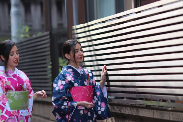 istock Italian girls in Kimono walking 649090768