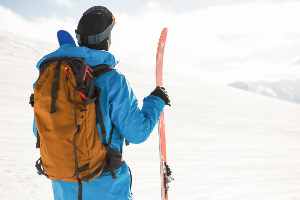 istock Skier looking at beautiful snow-covered mountains 649091724