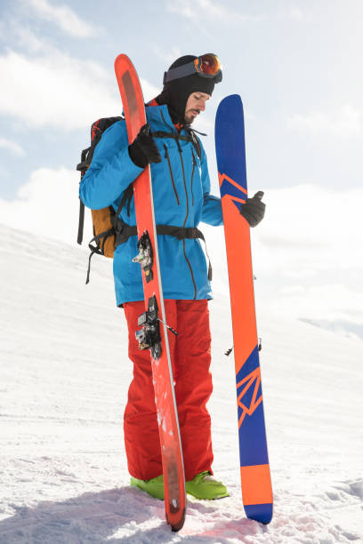 istock Skier holding ski on the snowy mountains 649093760