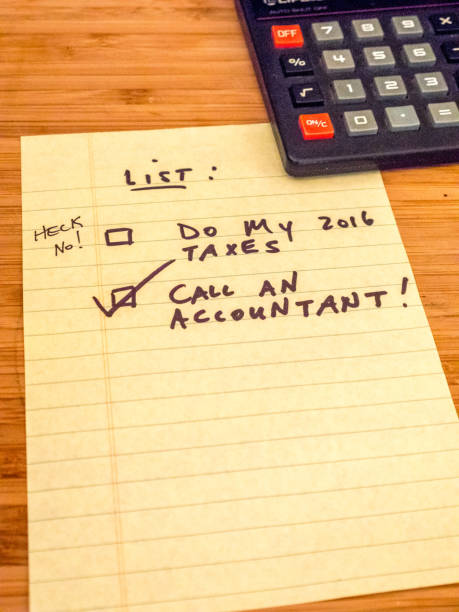 istock list with calculator reminding to call accountant, copy space 649094778