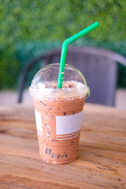 istock Ice chocolate drink on table with garden background 649103856