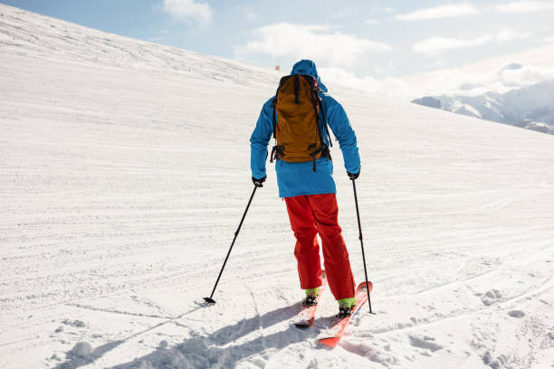 istock Skier skiing on snow covered mountains 649104246