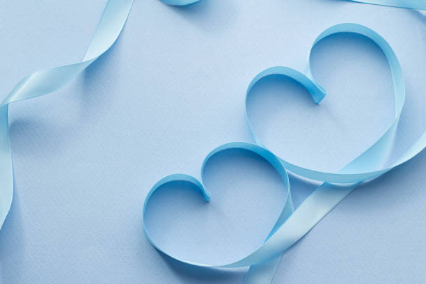 Heart with blue ribbon I imagine love with a blue ribbon. I imagine love with a blue ribbon. リボン stock pictures, royalty-free photos & images
