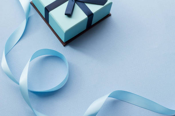 Image of present It is an image of a happy present of a blue ribbon and a box. リボン stock pictures, royalty-free photos & images