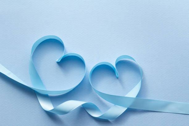 Heart with blue ribbon I imagine love with a blue ribbon. I imagine love with a blue ribbon. リボン stock pictures, royalty-free photos & images