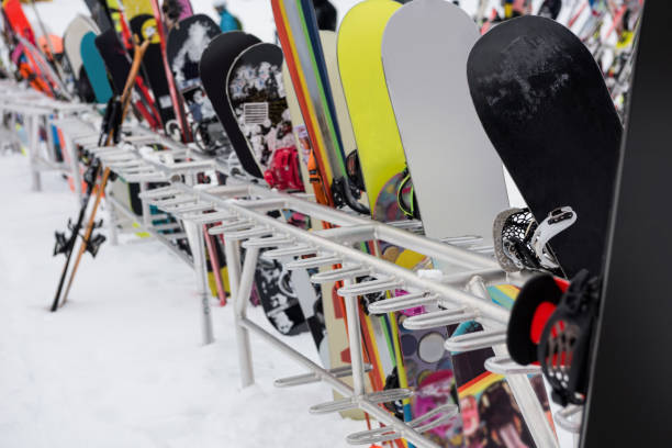 istock Snowboards and skis kept together 649107738