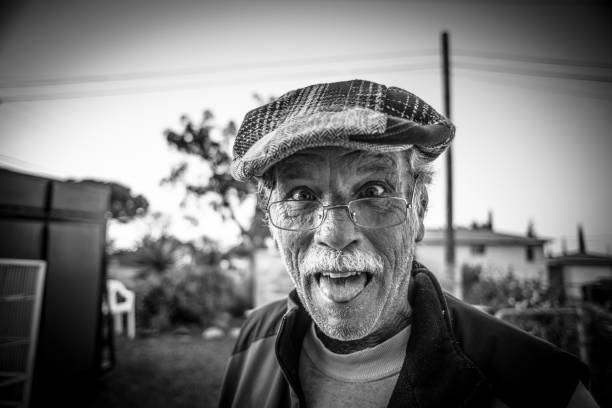 istock Goofy old man sticking out his tongue 649108334