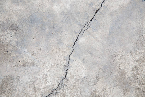 istock Cracked concrete texture, Crack in the wall background. 649112030