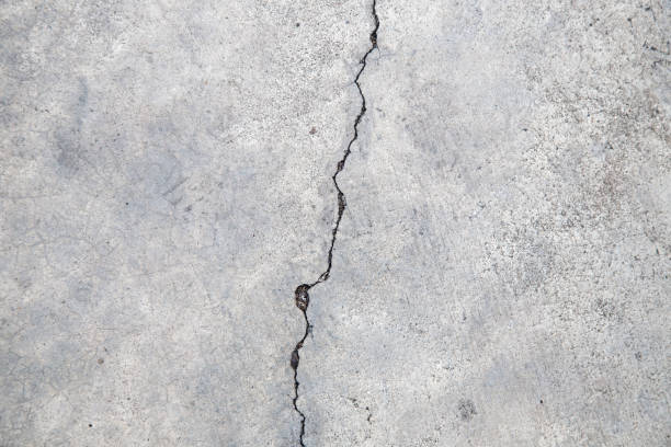 istock Cracked concrete texture, Crack in the wall background. 649112054