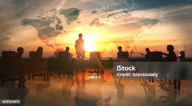 World Management Team In Office Silhouette Stock Photo - Download Image Now - In Silhouette, Leadership, Sunset