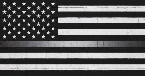 istock Black and white American Flag painted on a wall 649125030