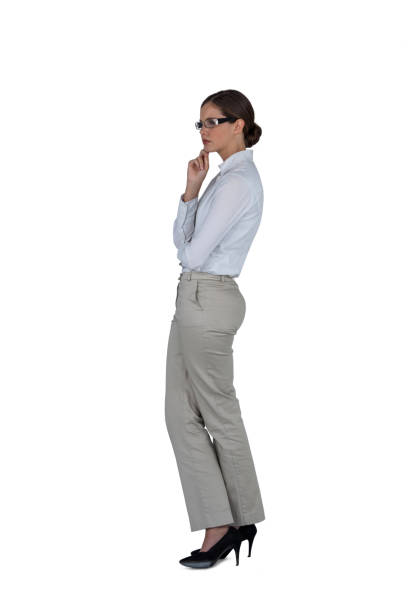 istock Businesswoman standing against white background 649126136