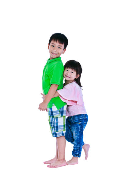 istock Asian sister hugging his brother smiling happily, isolated on white. 649132714