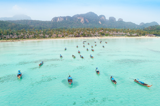 Aerial view of Long-Tail Boats at Ton Sai Bay on Phi Phi Island, Thailand. Sunrise. Converted from RAW.