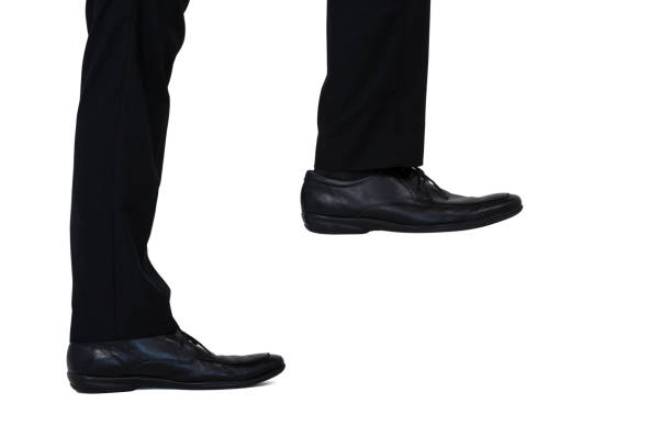 istock Low section of businessman climbing steps 649133704