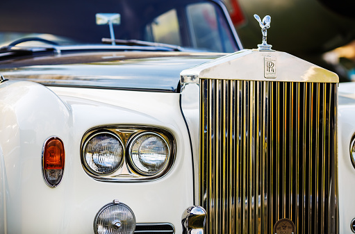 MINSK, BELARUS - MAY 07, 2016: Close-up photo of Rolls Royce. Close-up of the front part of the luxury retro car. Selective focus on the headlight.