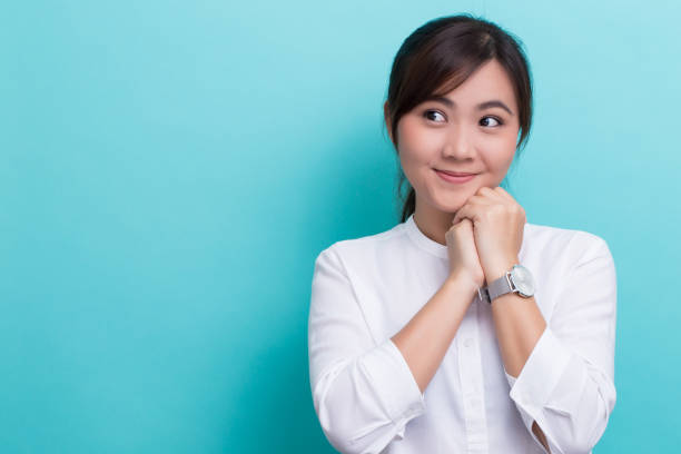 istock Asian woman thinking and happy 649135942