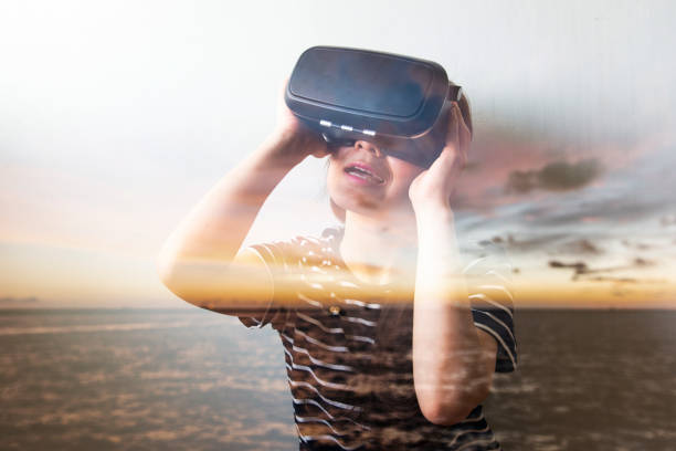 istock Double exposure of people using the virtual reality headset 649136562