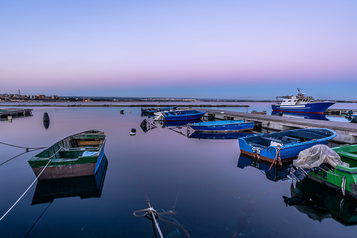 Fishing boats at twilight, Taranto, Apulia, Italy