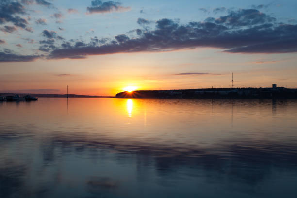 istock sunset over the town pond 649136824