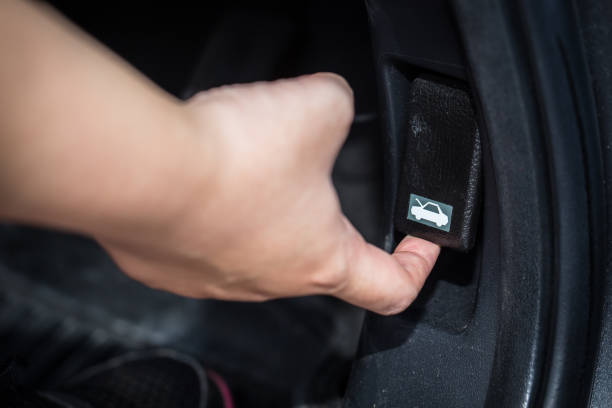 istock women hand open car hood unlock switch. 649140932