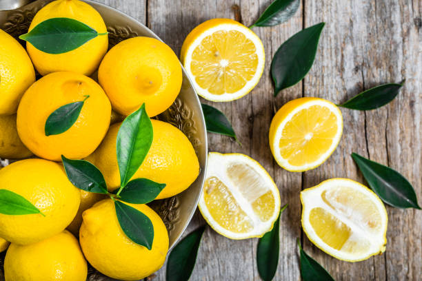 istock Fresh lemons on market table, top view 649143482
