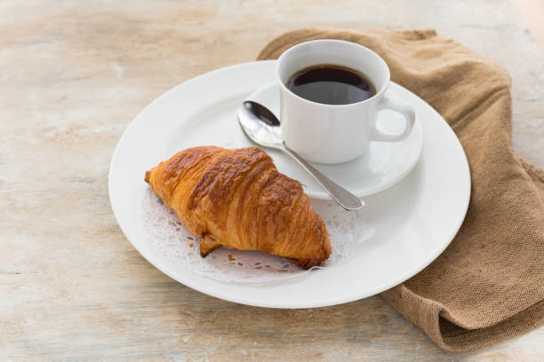 istock Coffee and fresh baked croissants 649145036