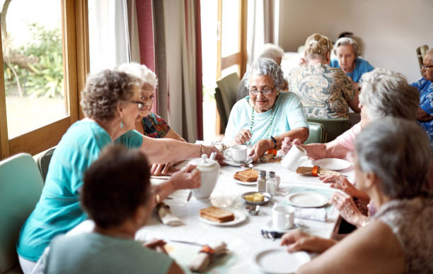 breakfast is their favourite meal of the day - senior adult nursing home eating home interior imagens e fotografias de stock
