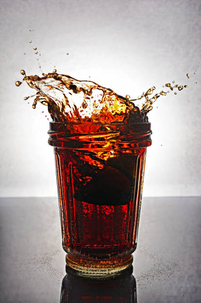 istock Splash in glass of cola 649152424