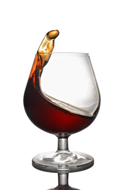 istock Splash in glass of cognac 649152478