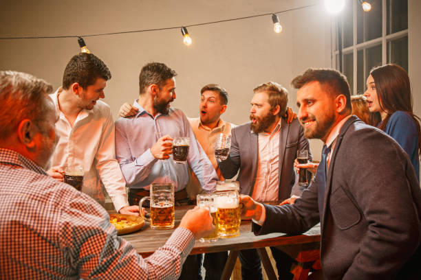 istock Group of friends enjoying evening drinks with beer 649156554
