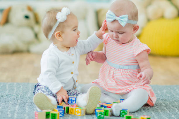 istock Twin Toddlers Playing Together 649159842