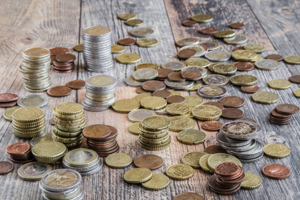 Money on the table. Euro coins from different countries.