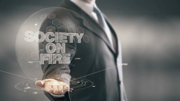 istock Society On Fire Businessman Holding in Hand New technologies 649163814