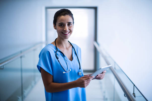 istock Female surgeon holding digital tablet 649164586