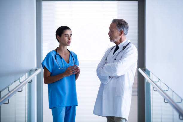 istock Doctor and colleague interacting with each other 649175778