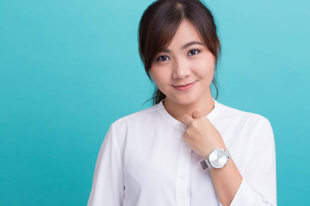 istock Asian woman with her watch 649176110