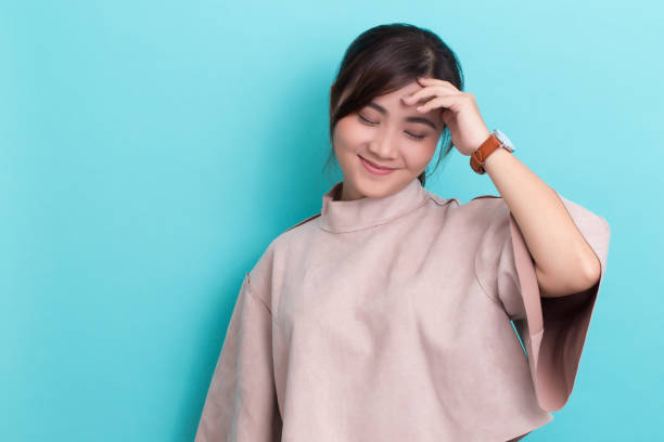 istock Asian woman with her watch 649176234