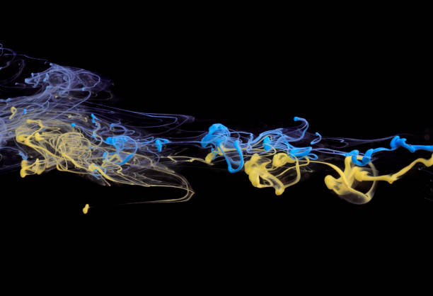 istock Yellow and blue ink in water 649179564