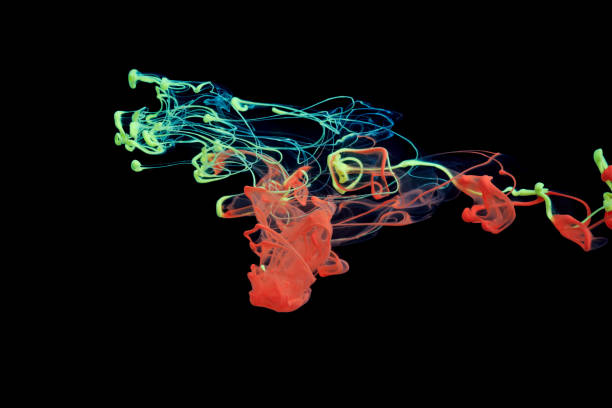 istock Red and yellow ink in water 649179624