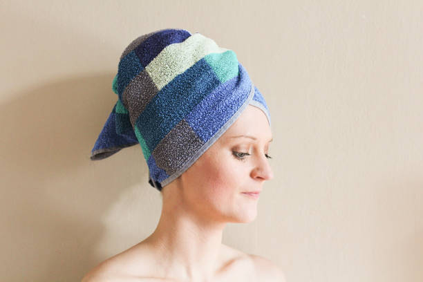istock Young woman with towel on head 649188016