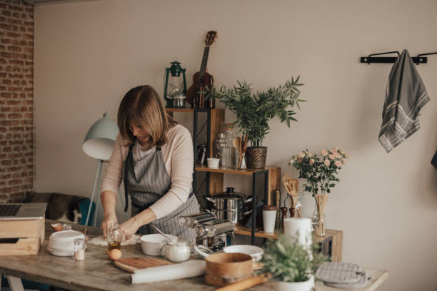 istock Woman preparing home made pasta 649188810
