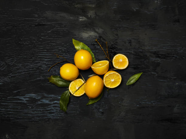 istock The fresh lemons on black background 649191038