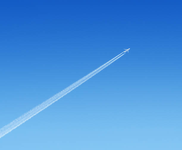 istock airplane high in the blue sky 649191576
