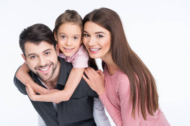 istock Happy young family with one child smiling at camera 649197810